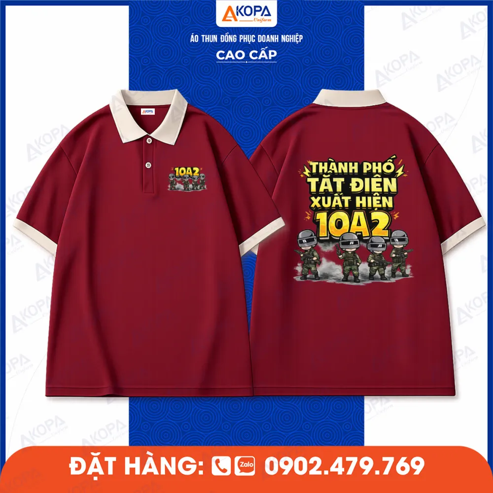 Áo lớp màu đỏ đô in số lớp 10A2 và slogan nổi bật phong cách hoạt hình
