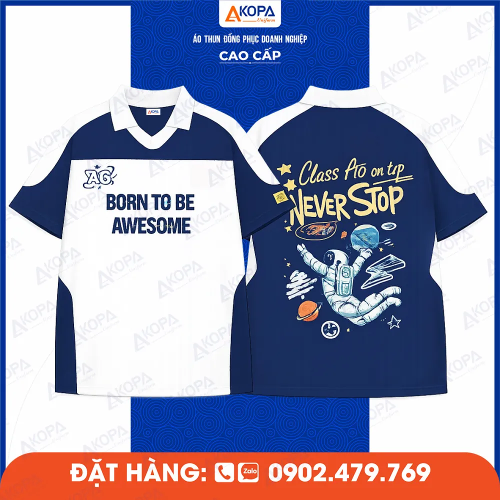 Áo lớp phối xanh trắng in slogan “Born To Be Awesome” và hình phi hành gia phía sau lưng
