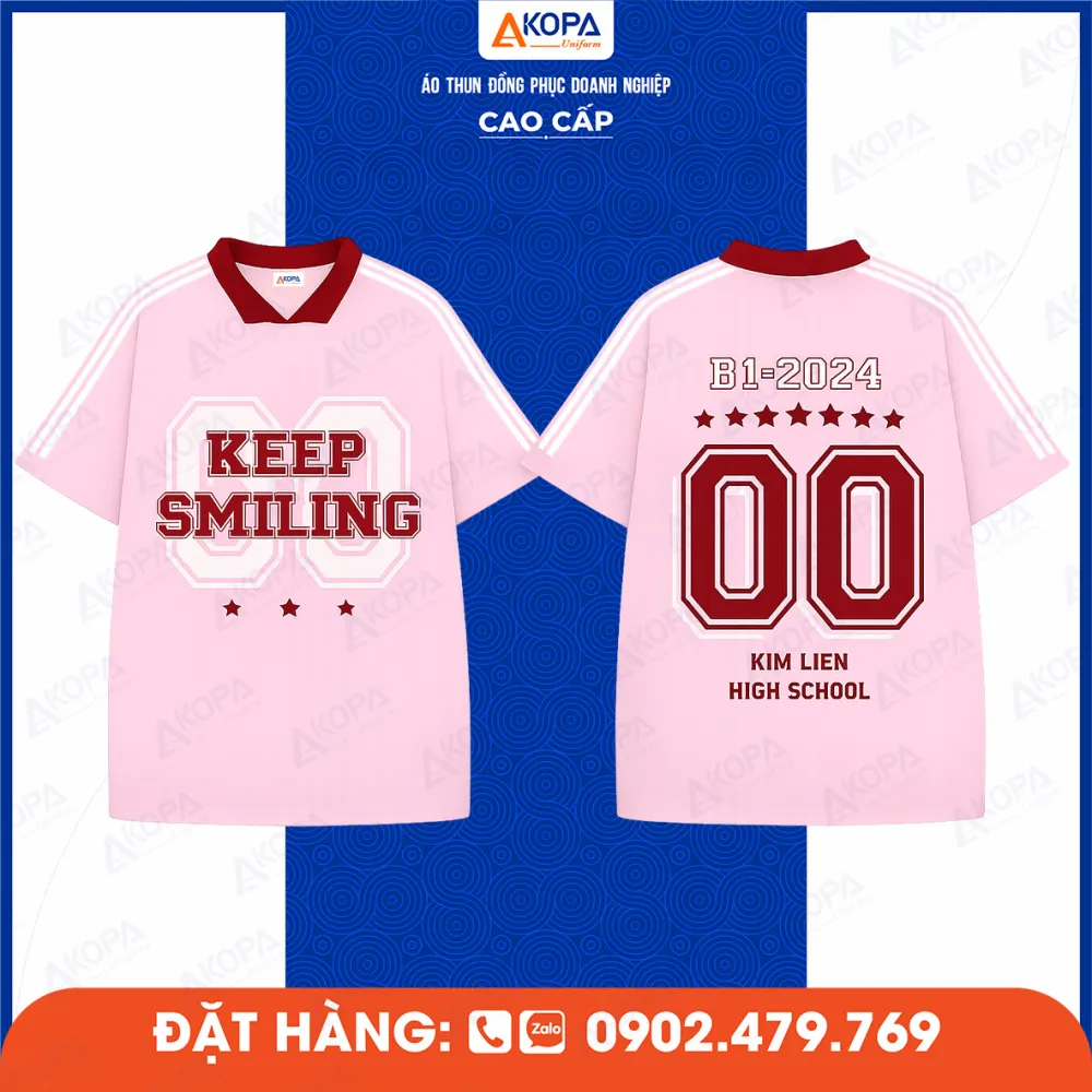 Áo lớp màu hồng in chữ Keep Smiling và số 00 phía sau